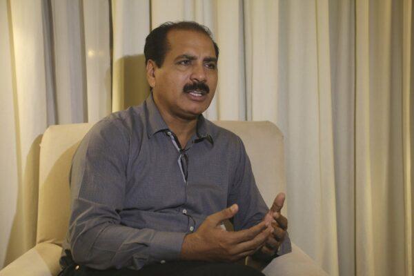 Christian activist Saleem Iqbal talks to The Associated Press regarding Pakistani brides trafficked to China, in Faisalabad, Pakistan, on Nov. 11, 2019. (K.M. Chaudary/AP Photo)