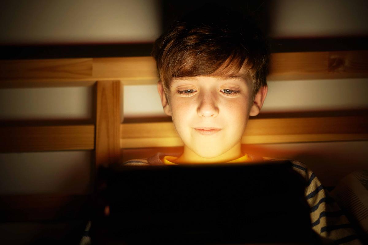 Illustration - Shutterstock | <a href="https://www.shutterstock.com/image-photo/happy-smiling-boy-sits-bed-before-1061388962">Larina Marina</a>