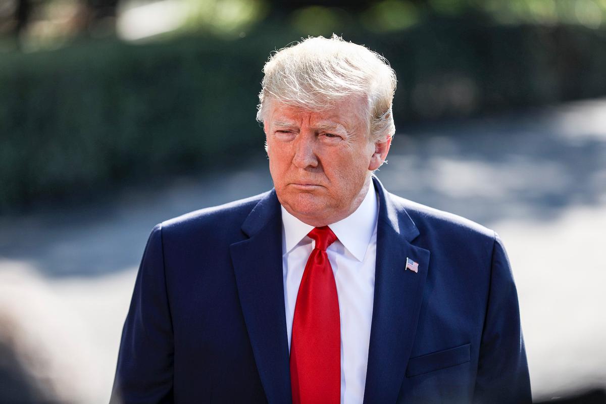 President Donald Trump speaks to media before departing on Marine One en route to Ohio and Texas, from the White House South Lawn in Washington on Aug. 7, 2019. (Charlotte Cuthbertson/The Epoch Times)