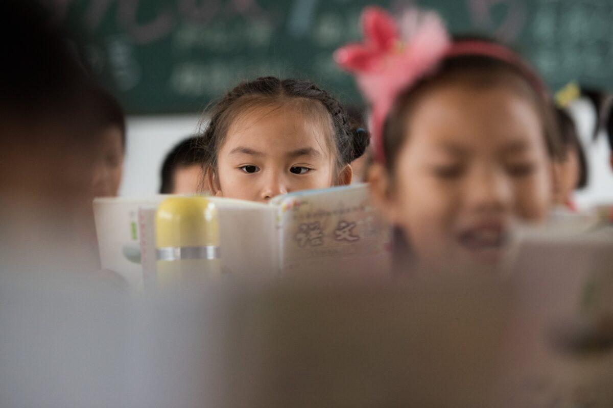 Chinese schoolchildren attending class at a primary school in Pingjiang County, Hunan Province, on Oct. 8, 2015. (Johannes Eisele/AFP via Getty Images)