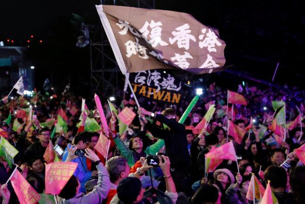 Hong Kong pro-democracy protesters attend a rally in support of Taiwan President Tsai Ing-wen outside the Democratic Progressive Party (DPP) headquarters in Taipei, Taiwan, on Jan. 11, 2020. (Tyrone Siu/Reuters)