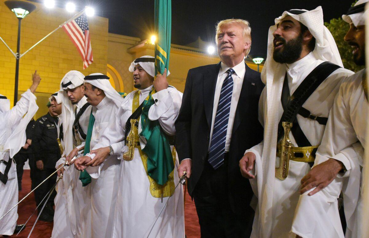 President Donald Trump joins dancers with swords during a ceremony ahead of a banquet at the Murabba Palace in Riyadh on May 20, 2017. (Mandel Ngan/AFP via Getty Images)