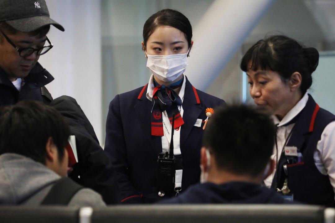 US Considers Expanding Screening of Airline Passengers for New Virus From China