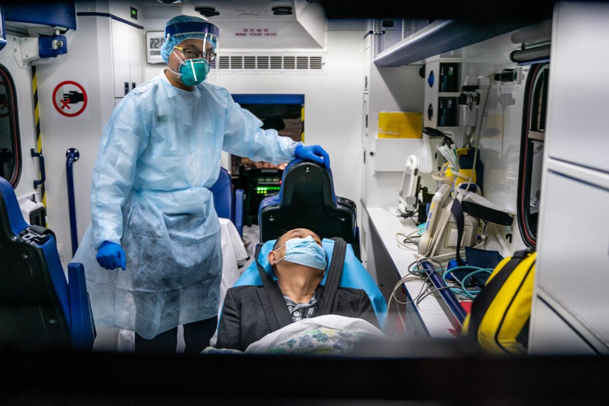 A patient is transferred by an ambulance to the Infectious Disease Centre of Princess Margaret Hospital in Hong Kong, China, on Jan. 22, 2020. (Anthony Kwan/Getty Images)
