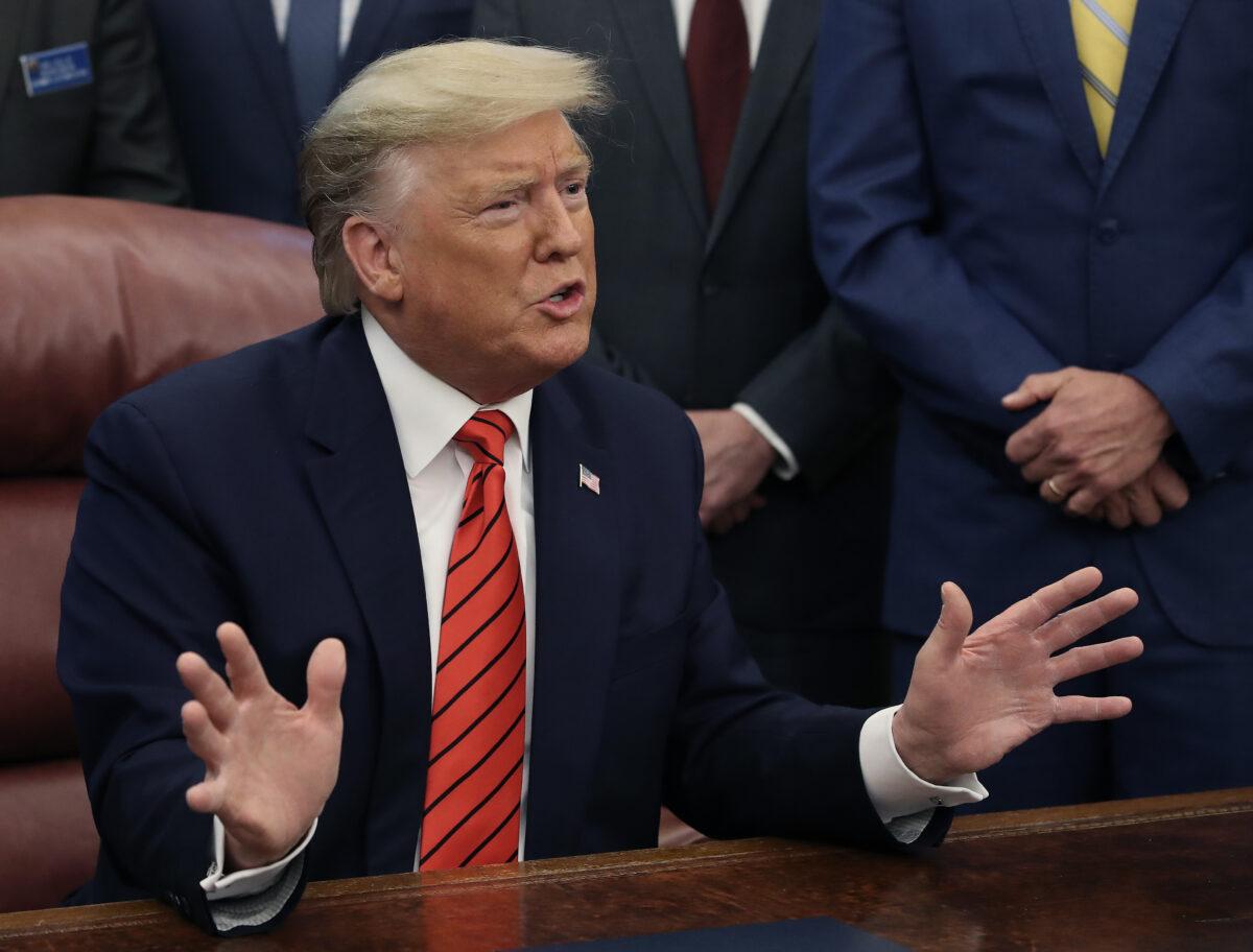 President Donald Trump speaks to reporters about Roger Stone during an unrelated event in Washington on Feb. 11, 2019. (Mark Wilson/Getty Images)