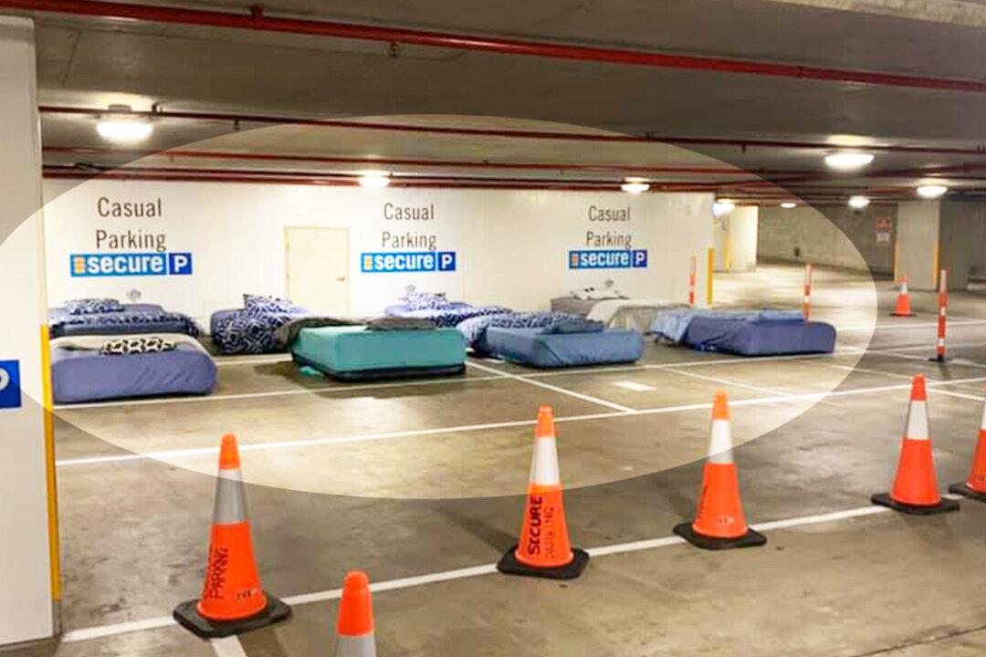 Homeless Sleep on Real Beds in Empty Parking Garage Thanks to Safe Overnight Shelter Program