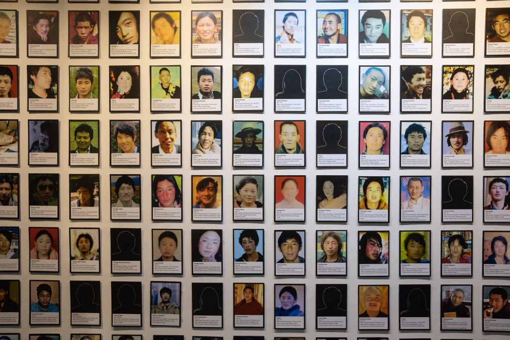 This photo shows a wall at the Tibet Museum in McLeod Ganj in Himachal Pradesh state covered with portraits of young Tibetans who self-immolated in protest against Chinese rule in Tibet. (©Getty Images | <a href="https://www.gettyimages.com/detail/news-photo/this-photo-taken-on-december-26-shows-a-wall-covered-with-news-photo/1075371818">Laurene Becquart/AFP</a>)
