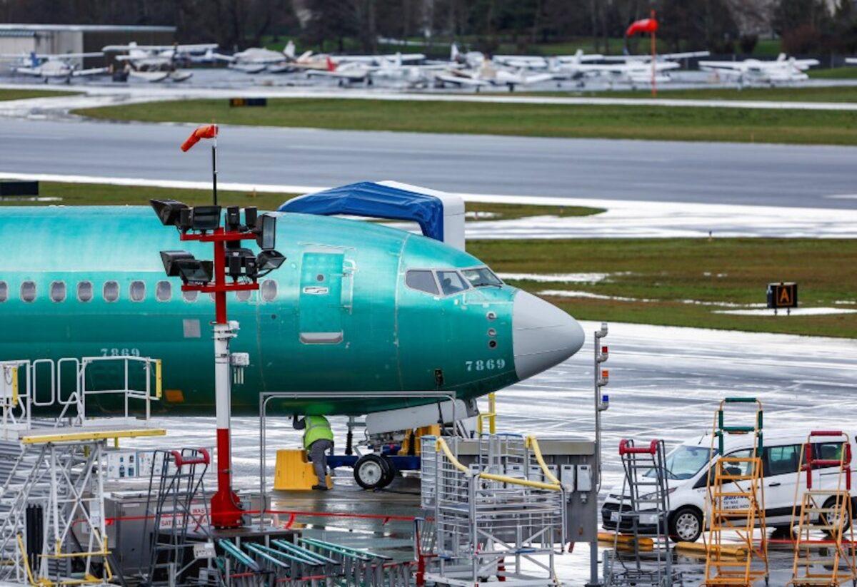 An employee works on a Boeing 737 Max aircraft at the Renton Municipal Airport in Renton, Washington on Jan. 10, 2020. (Lindsey Wasson/Reuters)
