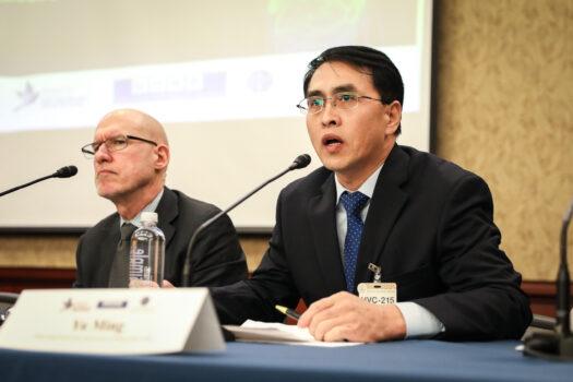 Yu Ming (R), Falun Gong practitioner and survivor of Chinese labor camp, speak at the Policy Forum on Organ Procurement and Extrajudicial Execution in China as Donald Clarke, Chinese law specialist at George Washington University, listens on Capitol Hill on March 10, 2020. (Samira Bouaou/The Epoch Times)