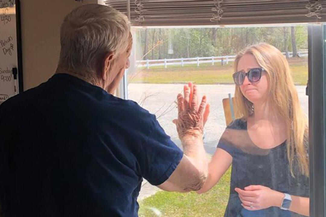 Woman Reveals Engagement Ring to Isolated Granddad Through Care Center Window Amid Pandemic