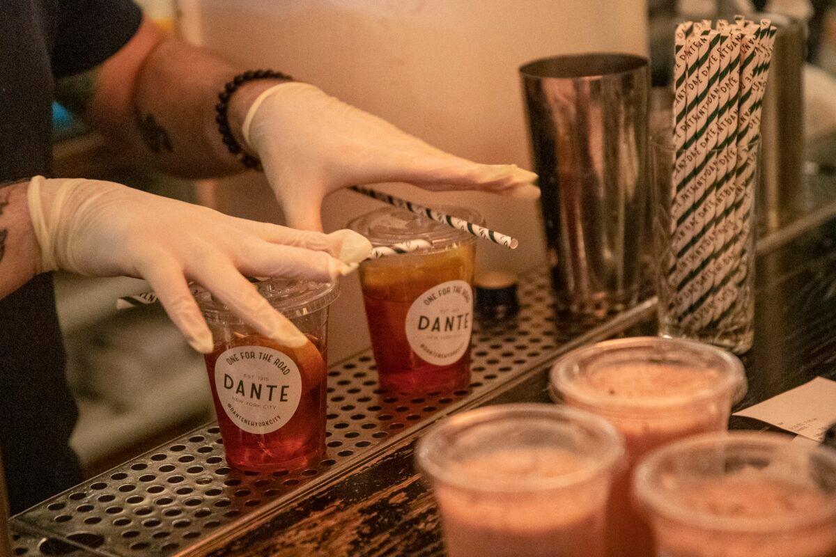 Bartender Andy Bechtol makes cocktails to-go at Caffe Dante bar and restaurant in Manhattan as the COVID-19 outbreak continued unabated in New York City on March 19, 2020. Bars and restaurants were closed by the city days ago but were allowed to sell food and now alcohol to go. (Victor J. Blue/Getty Images)