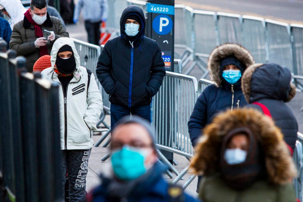People line up to get be tested for the CCP virus at Elmhurst Hospital in Queens, New York, on March 24, 2020. (Eduardo Munoz Alvarez/Getty Images)