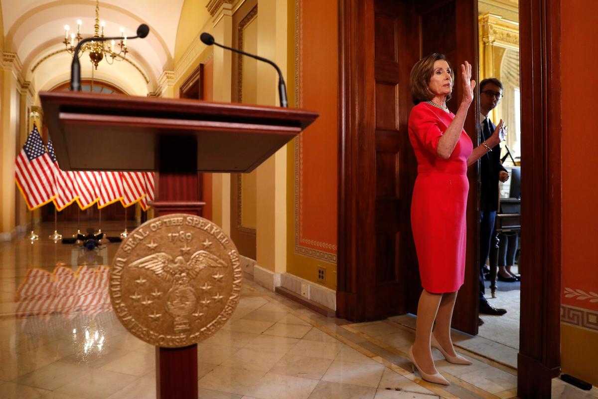 Man in Viral Photo Carrying Pelosi’s Lectern Is Arrested