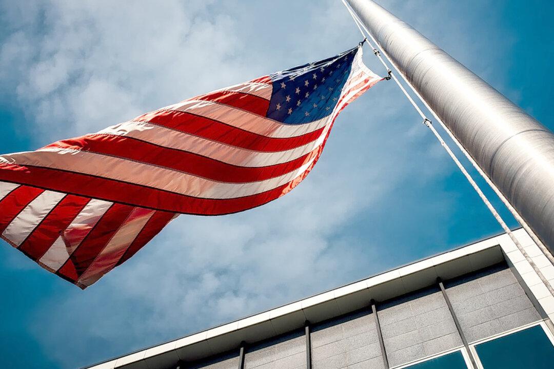 Photo of Boy Praying Alone in Front of Flagpole for First Amendment, Religious Freedom, Goes Viral