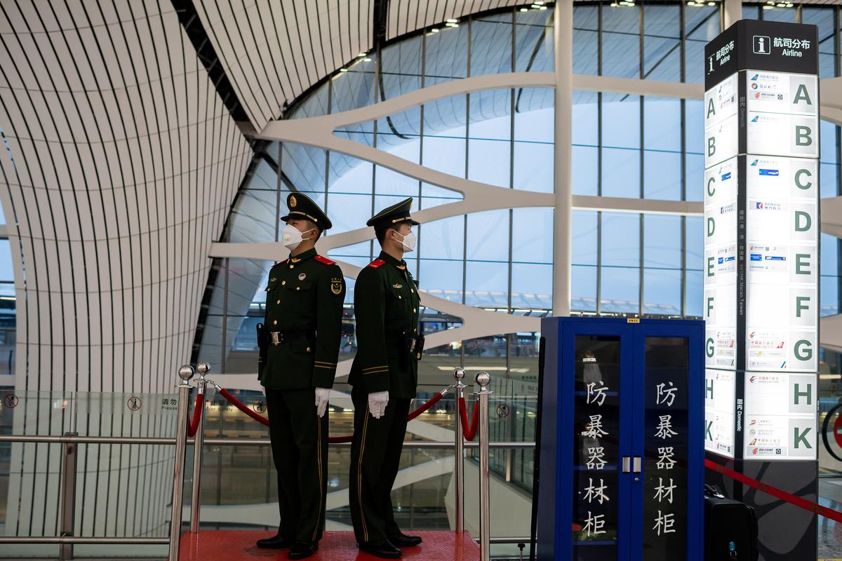 Chinese paramilitary police officers secure an area at Daxing international airport in Beijing on Feb. 14, 2020. (Nicolas Asfouri/AFP via Getty Images)