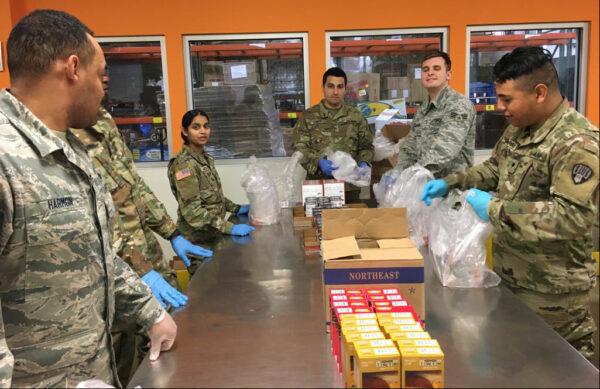 New York Army and Air National Guard members pack food parcels at Feeding Westchester, a food pantry in Westchester County, N.Y. on March 12, 2020. (U.S. Army National Guard photo by Col. Steve Rowe)