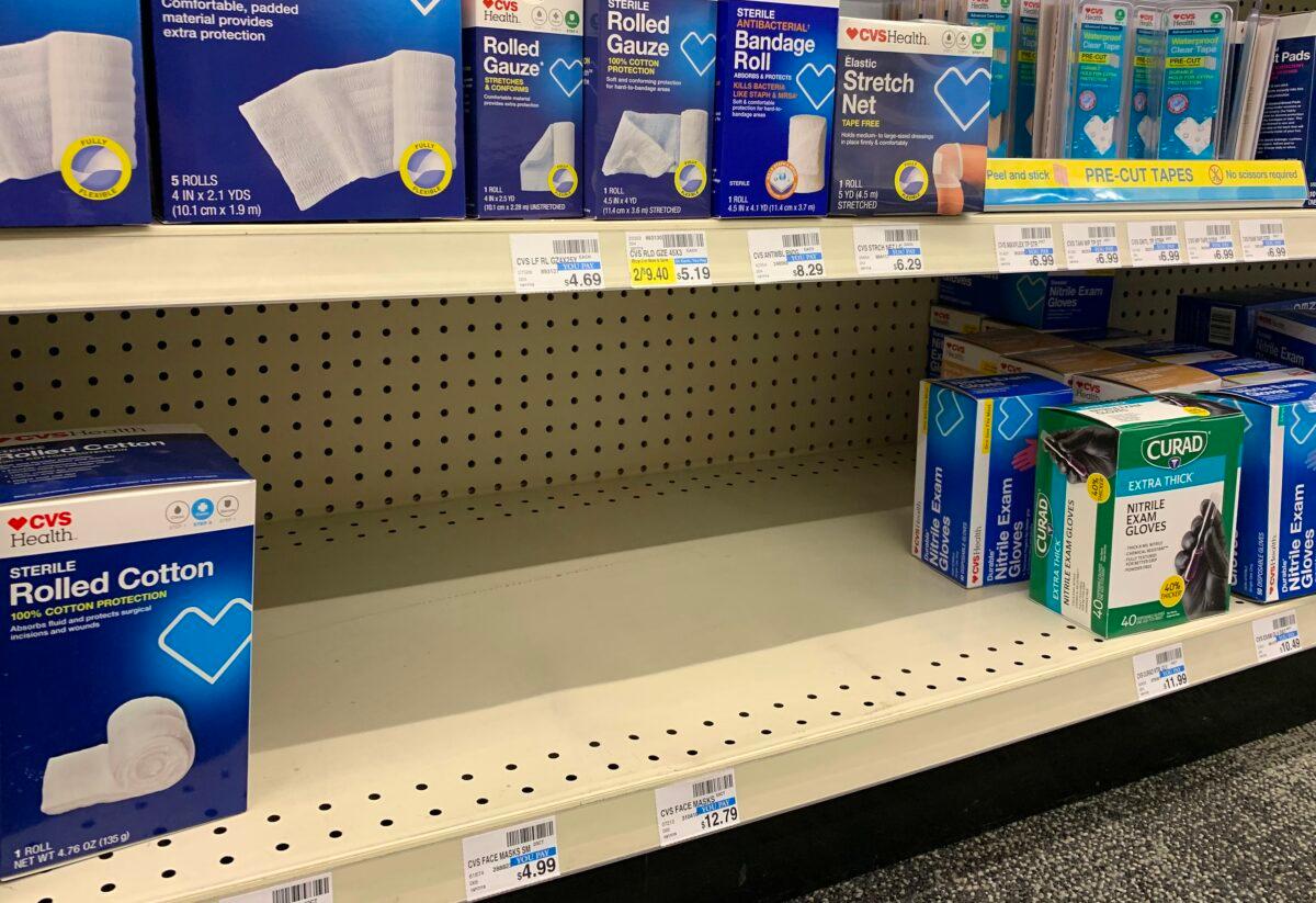 An empty shelf in a local pharmacy that used to contain protective masks which are now sold out, as people scramble to protect against the spread of the CCP virus, in Los Angeles, California on Jan. 22, 2020. (Mark Ralston/AFP via Getty Images)