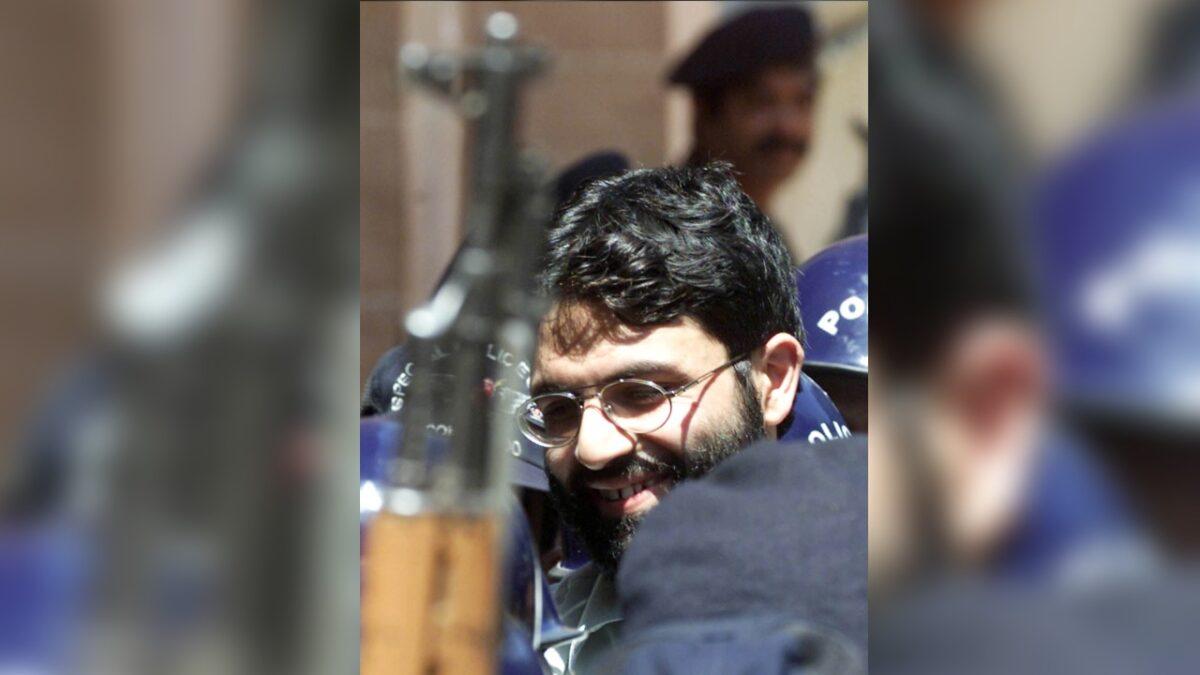 British-born Islamic terrorist Ahmed Omar Saeed Sheikh is surrounded by armed police as he arrives at a court in Karachi, Pakistan, on March 29, 2002. (Zahid Hussein/File Photo/Reuters)