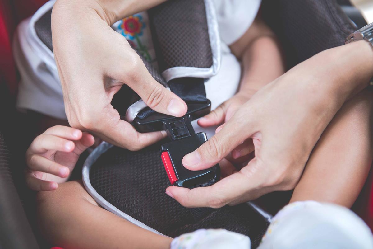 Illustration - Shutterstock | <a href="https://www.shutterstock.com/image-photo/protection-car-hands-woman-fastening-security-389096983">Odua Images</a>
