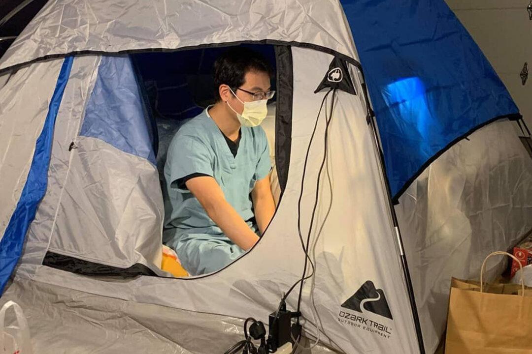 Doctor Treating COVID-19 Patients Moves Into Tent in Garage to Protect His Family