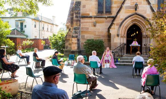 Father James Collins holds a service in the yard of St Paul's Anglican Church in Burwood with seating observant of social distancing on March 22, 2020 in Sydney, Australia. (Jenny Evans/Getty Images)