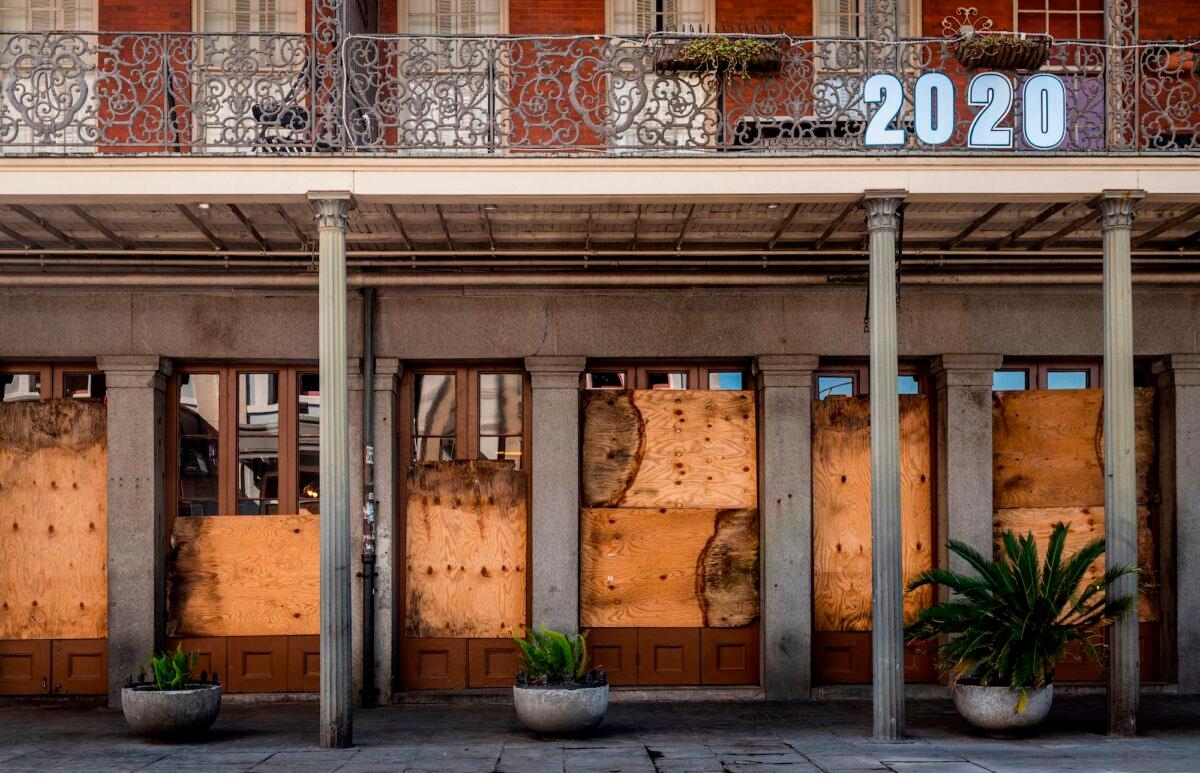 A shuttered business is pictured on Decatur Street in New Orleans, La., on March 26, 2020. (Emily Kask/AFP/Getty Images)