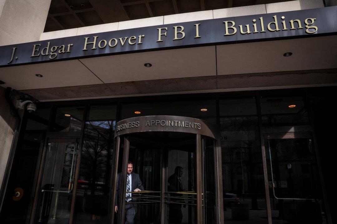 FBI, CIA Analysts Working Trump Probe Bought Liability Insurance After 2016 Election, Text Messages Show
