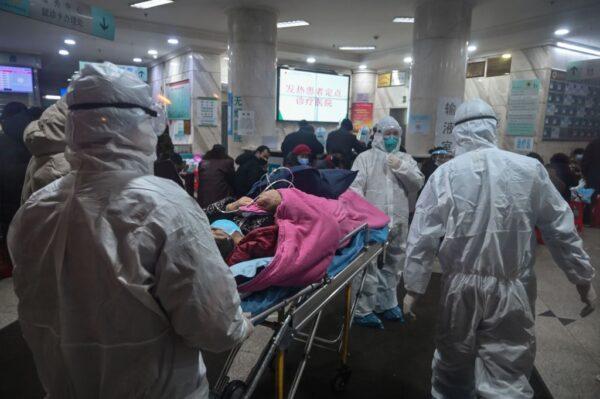 Medical staff in protective clothing to protect against a CCP virus patient at the Wuhan Red Cross Hospital in Wuhan, China, on Jan. 25, 2020. (Hector Retamal/AFP via Getty Images)