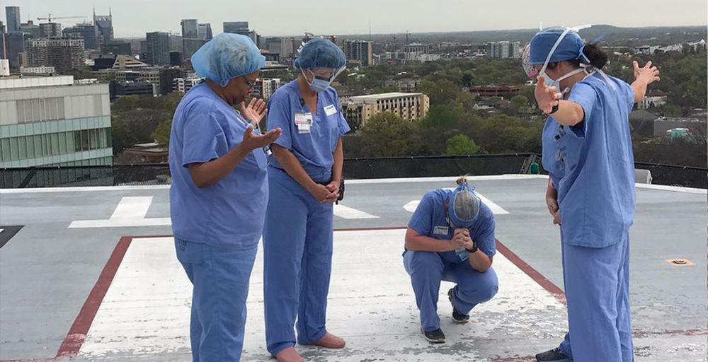 Nurses Gather at Hospital Helipad to Pray for Patients and Families Amid COVID-19 Outbreak