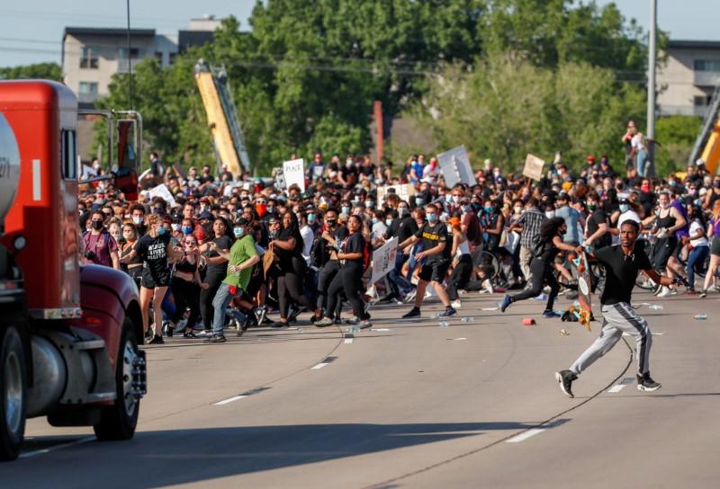 A tanker truck drives into a crowd of protesters marching on I-35 during a protest against the death in Minneapolis police custody of George Floyd, in Minneapolis, Minn., on May 31, 2020. (Eric Miller/Reuters)