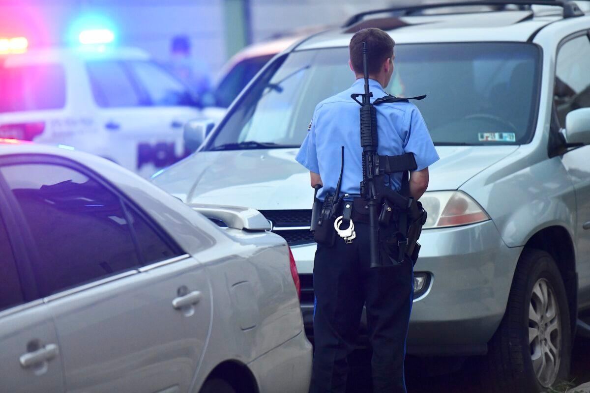 File photo showing a Philadelphia police officer monitoring activity while responding to a shooting in Philadelphia, Pennsylvania. (Mark Makela/Getty Images)