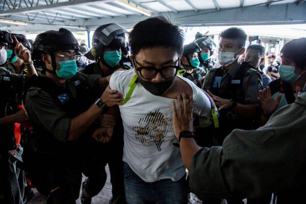 Police officers arrest a demonstrator (C) during a pro-democracy protest calling for the city's independence in Hong Kong, China, on May 10, 2020. (Isaac Lawrence/AFP via Getty Images)