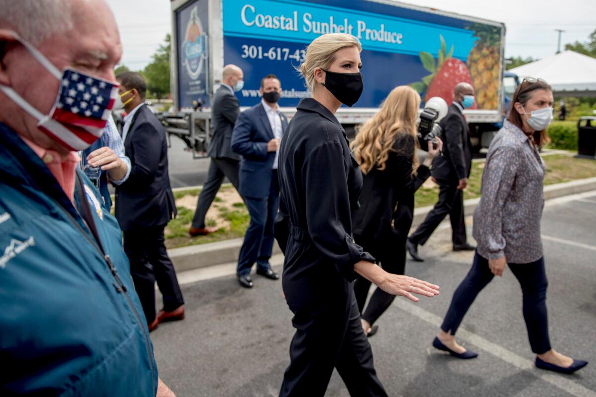 White House adviser Ivanka Trump (C) and Agriculture Secretary Sonny Perdue (L) depart following a tour of Coastal Sunbelt Produce, in Laurel, Md., on May 15, 2020. (Andrew Harnik/AP Photo)