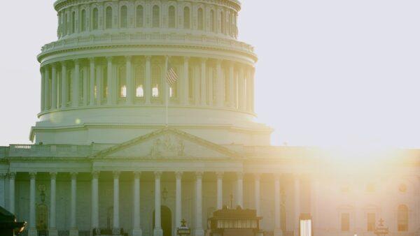 A U.S. flag flies in front of the Capitol building in Washington on May 13, 2020. (York Du/The Epoch Times)