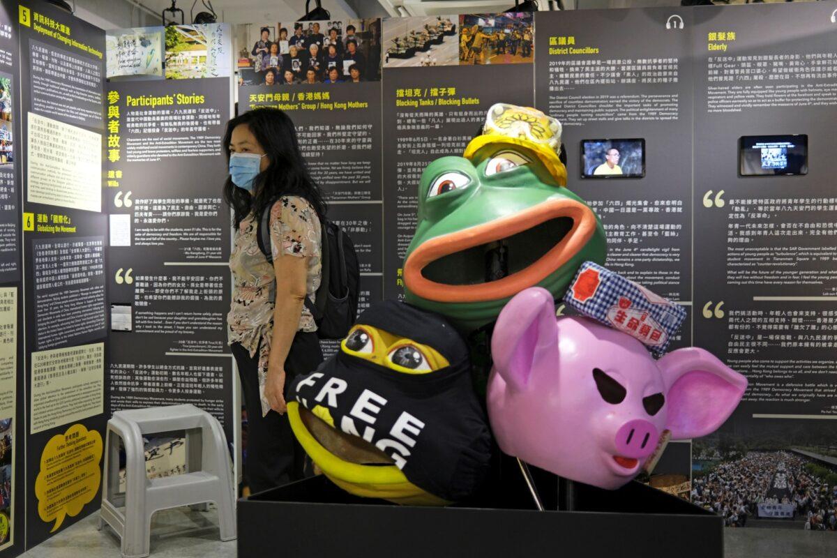 A visitor looks at an exhibition board during the opening of anti-extradition bill protest special exhibition at the June 4th Museum for the 1989 Tiananmen crackdown, in Hong Kong, China, on May 20, 2020. (Tyrone Siu/Reuters)