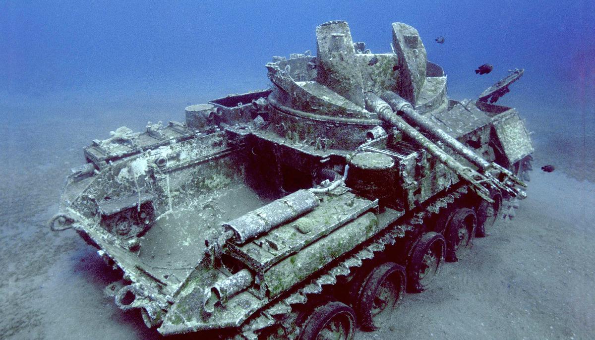 Underwater Photographer Takes Eerie Images of Sunken Tank Trapped in Time Under the Red Sea