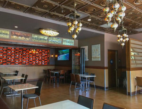 Half the dining tables are removed and the remaining ones are spaced further apart at Tarla Mediterranean Bar and Grill in Napa, Calif., on May 23, 2020. (Ilene Eng/The Epoch Times)
