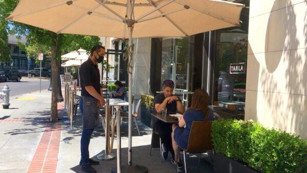 Some diners eat outside at Tarla Mediterranean Bar and Grill in Napa, Calif., on May 23, 2020. (Ilene Eng/The Epoch Times).