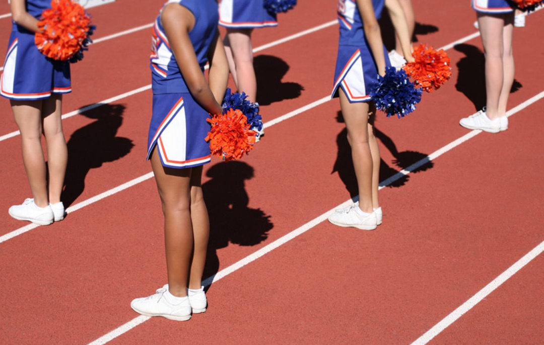 High School Cheerleader Sees Toddler Choking During Parade, Performs Heimlich, Saves His Life