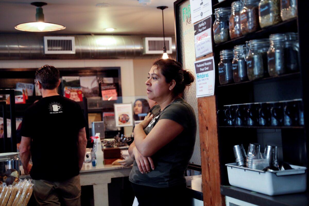 Alcira Perez, a dishwasher of nine years at Farley’s East Cafe that closed due to the financial crisis caused by the CCP virus lockdowns, during an employee meeting at the cafe in Oakland, Calif., on March 18, 2020. (Reuters)