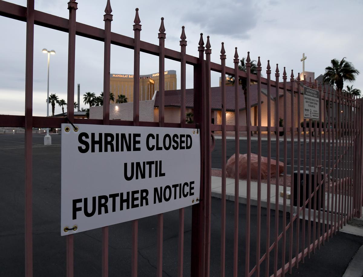 The shuttered Mandalay Bay Resort and Casino is seen through a fence with a closed sign posted at the Shrine of the Most Holy Redeemer Roman Catholic Church in Las Vegas, Nev., as a result of the statewide lockdown due to the continuing spread of the CCP virus across the United States on March 28, 2020. (Ethan Miller/Getty Images)