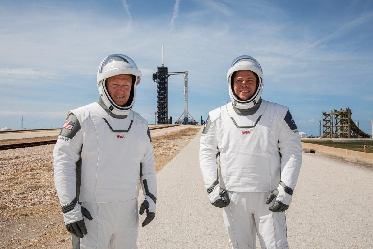NASA astronauts Douglas Hurley, left, and Robert Behnken pose while participating in a dress rehearsal for launch at the agency’s Kennedy Space Center ahead of NASA’s SpaceX Demo-2 mission to the International Space Station in Cape Canaveral, Fla., on May 23, 2020. (Kim Shiflett/NASA via Reuters