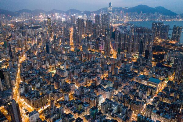 This aerial photo taken on Oct. 23, 2018, shows commercial and residential buildings in Hong Kong at night. (Dale de la Rey/AFP via Getty Images)