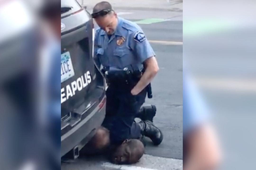 New Video Appears to Show Three Police Officers Kneeling on George Floyd