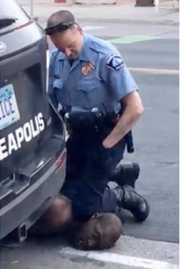 A Minneapolis officer kneels on the neck of George Floyd, a handcuffed man who was pleading that he could not breathe, in Minneapolis on May 25, 2020. (Darnella Frazier via AP, File)