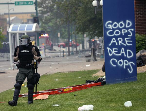 A police officer stands guard in Minneapolis, Minn. on May 29, 2020. (Scott Olson/Getty Images)