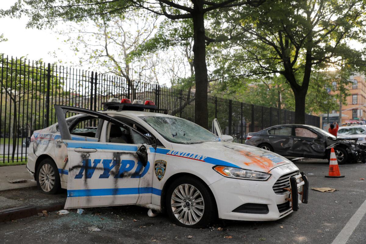 A vandalized New York Police Department vehicle is seen after a protest following the death of George Floyd in Minneapolis Police custody, in New York City on May 30, 2020. (Andrew Kelly/Reuters)
