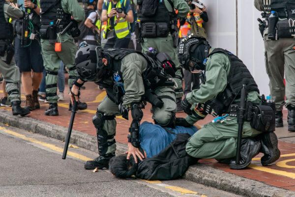 Riot police detain a pro-democracy supporter during a protest in Hong Kong on May 24, 2020. (Anthony Kwan/Getty Images)