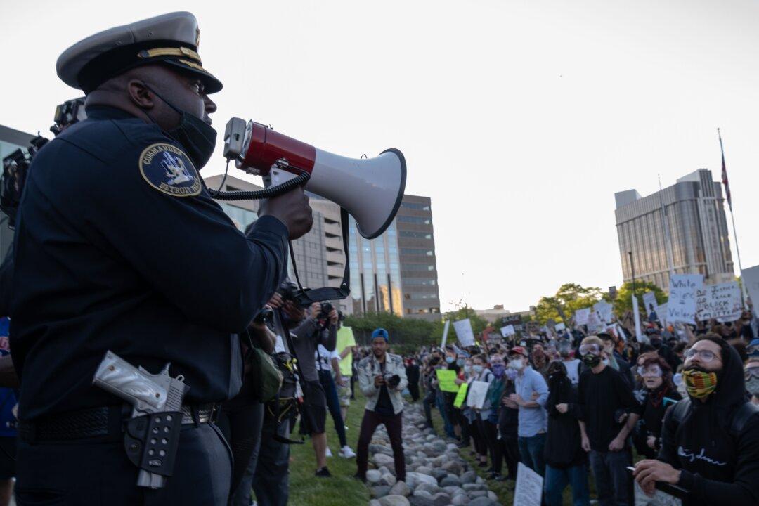 Sheriff Removes Helmet and Joins George Floyd March in Michigan