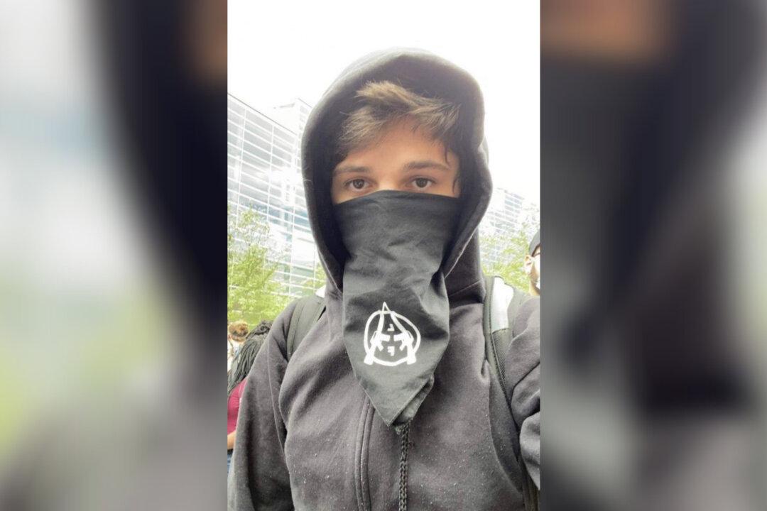 Anarchist Accused of Inciting a Riot Surrenders to Police